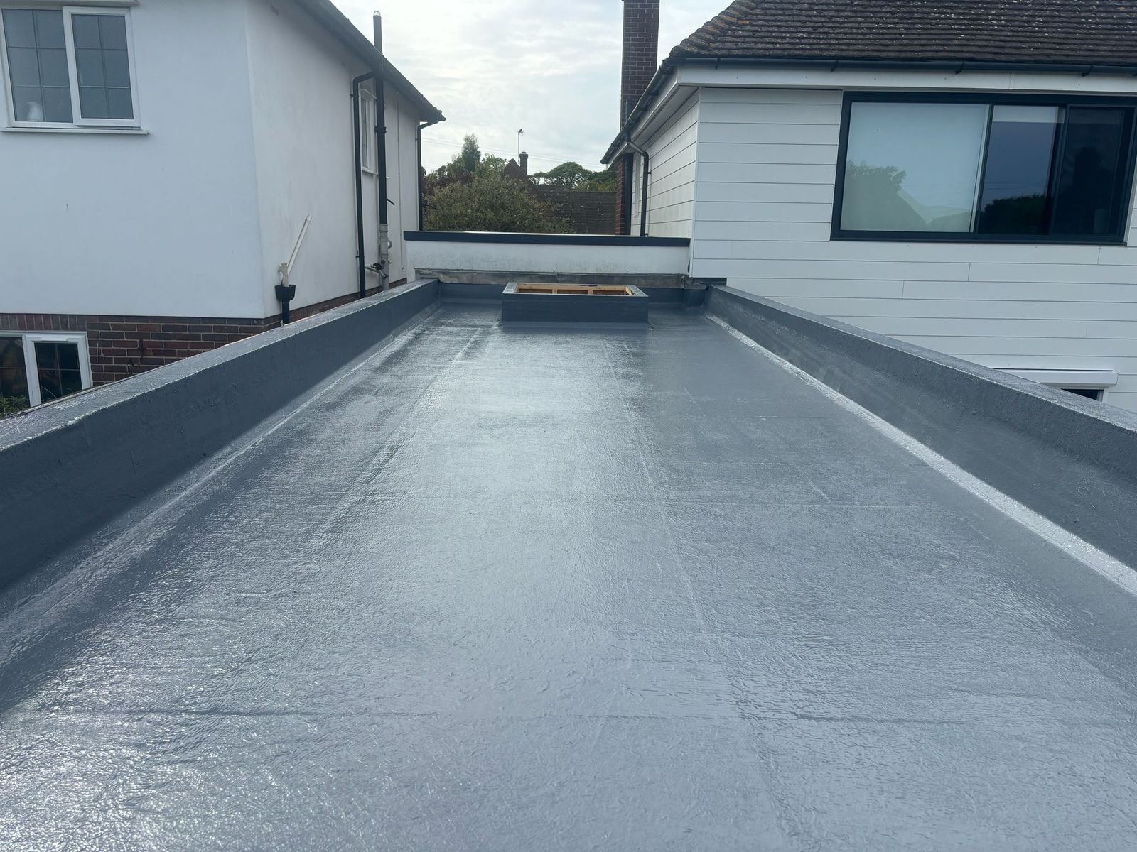 GRP fibreglass flat roof with skylight upstand